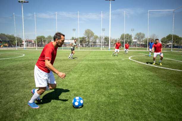 istock Friends playing soccer 1395367533