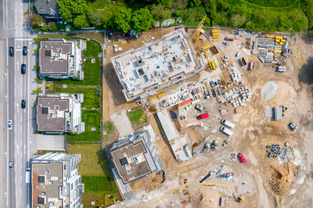 istock Large construction site, cranes and equipment - aerial view 1395367588