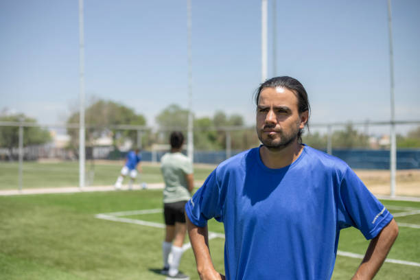 istock Friends playing soccer 1395368840