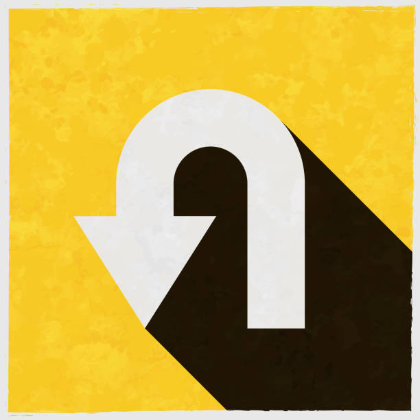 U-turn direction arrow. Icon with long shadow on textured yellow background Icon of "U-turn direction arrow" in a trendy vintage style. Beautiful retro illustration with old textured yellow paper and a black long shadow (colors used: yellow, white and black). Vector Illustration (EPS10, well layered and grouped). Easy to edit, manipulate, resize or colorize. Vector and Jpeg file of different sizes. undo key stock illustrations