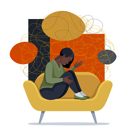 Young depressed female character sitting on a sofa.