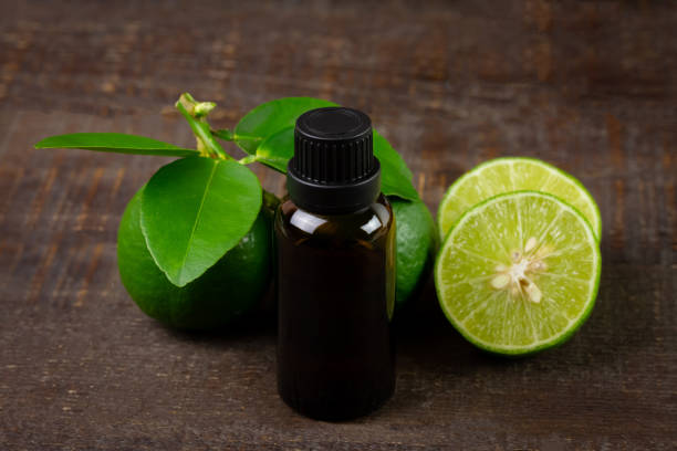 istock Lime essential oil in glass bottle for healtyh. 1395370025