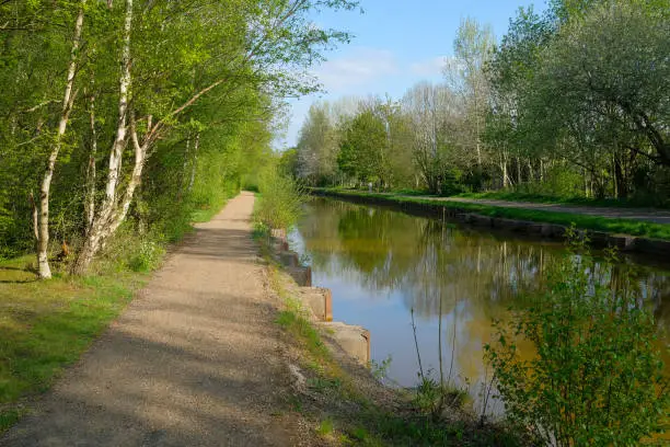 Photo of bridgewater canal and tow path walk and cycle way between worsley and monton