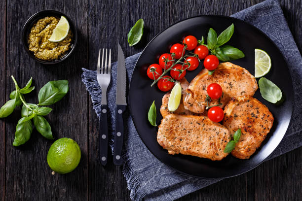 istock tomato basil pesto fried pork cutlets on plate 1395375450