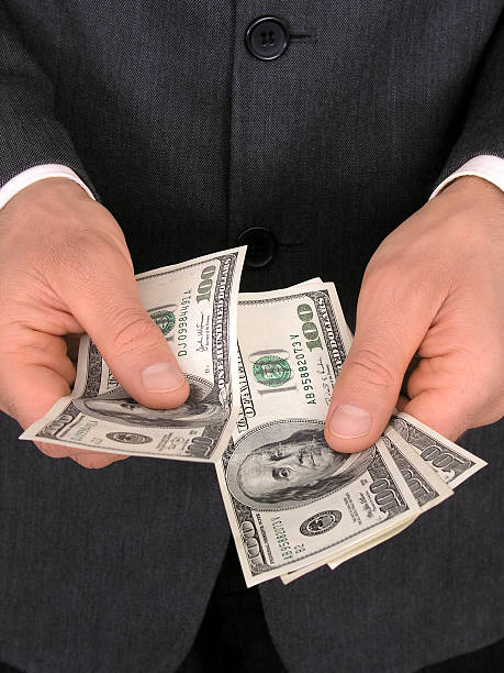istock Businessman Counting Money 139537593