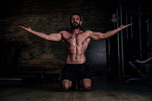 Body Building Workout. Muscular men Standing Strong