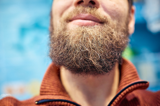Men's short beard and lips close up.