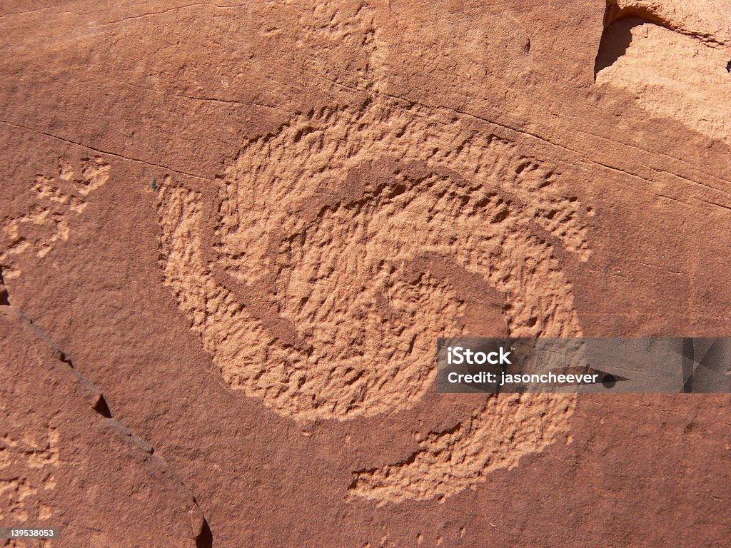 Spiral Petroglyph Spiral petroglyph chipped into rock at Dinosaur National Monument, Utah, U.S.A. Taken 27 May 2005. American Culture Stock Photo