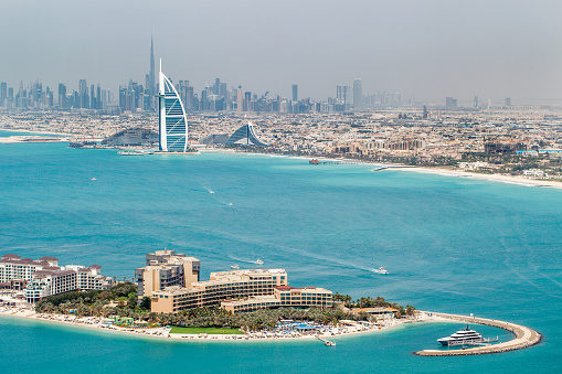 Dubai, UAE – april 18, 2022: view from the observation deck The Palm Tower on center of Dubai, Burj Khalifa, Burj Al Arab, Jumeirah Beach Hotel, Rixos The Palm Hotel Suites