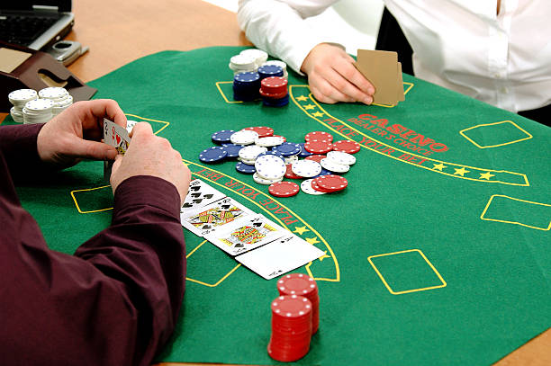 Texas Hold um Office workers playing a friendly game ofTexas Hold um Poker in the office. child gambling chip gambling poker stock pictures, royalty-free photos & images