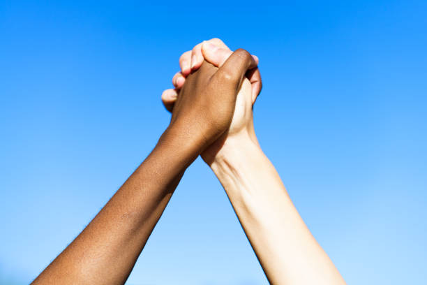 Friends with hands together celebrating