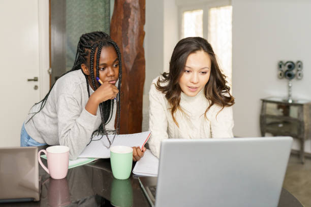 Free Stock Photo of Two college girls studying together at home with ...