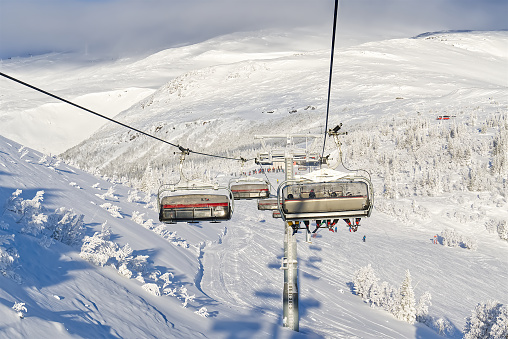 ski lifts in scandinavian resort. ski resort, slope, ski lift with snow, Lapland. winter skiing resort