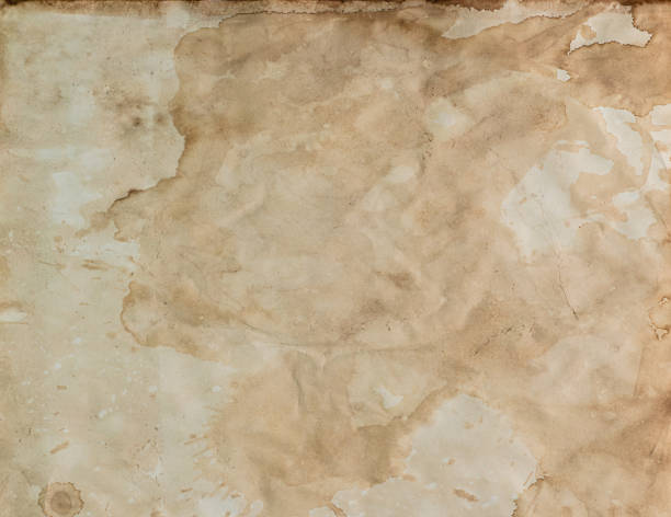 istock Calligraphy education and school concept. Ancient parchment papers on the wood table, old weathered burnt textured paper supply. Paper for writing and book making. 1395391677