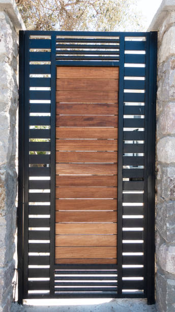 istock Wooden door with  brick stone wall 1395391746