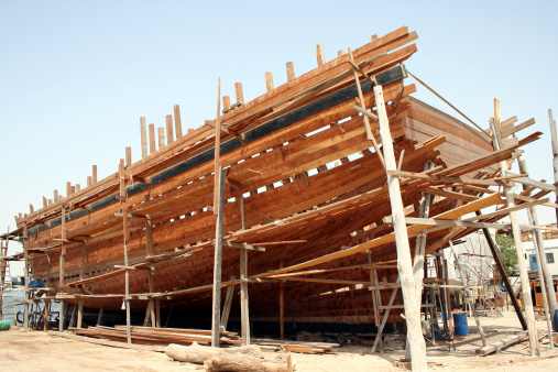 A traditional arabic dhow being constructed at the wharfage in Dubai
