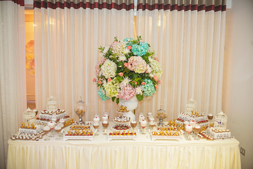 decoration elements, dishes, sweets, cakes for 15 years party in pink