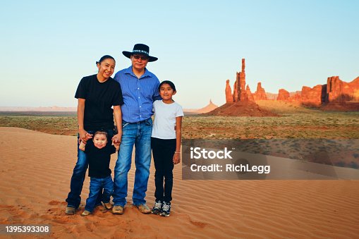 istock Navajo Family in Monument Valley 1395393308