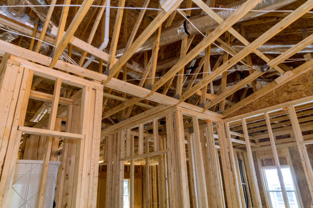 istock Framing of a new wooden house under construction 1395393468