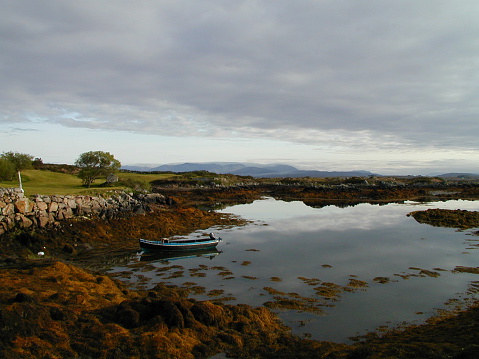 Looking across the bay to the 9th fairway on a calm, clear morning in the far west of Ireland.