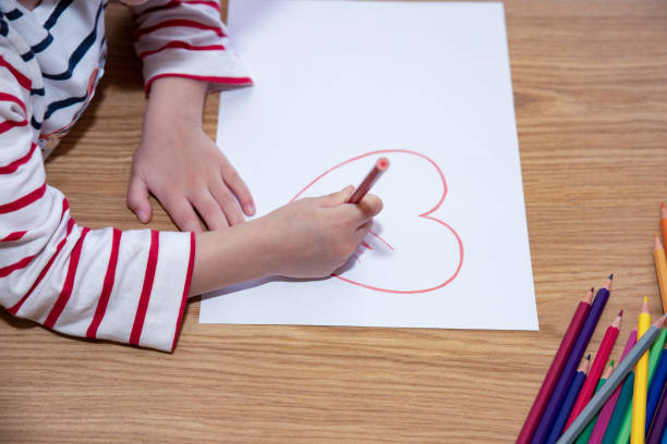 istock little girl drawing on floor 1395395755