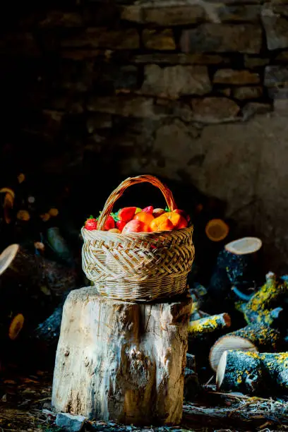 basket of fruit in a firewood room of an old country house