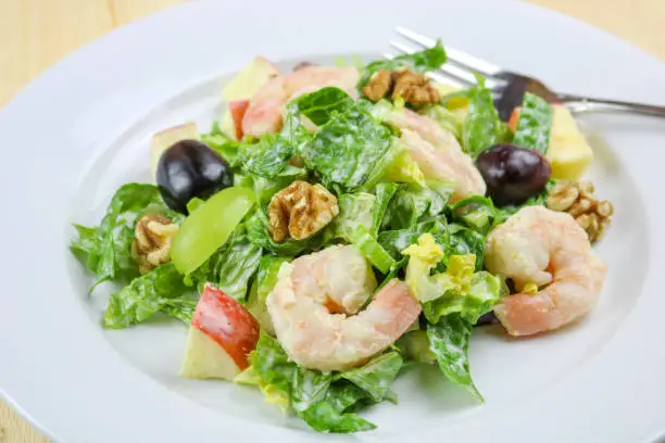 A freshly made Waldorf salad with shrimp.