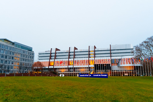STRASBOURG, FRANCE - Decembre, 2021: Council of Europe Strasbourg. EU building. EU Flags.