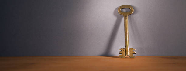 istock vintage key on wooden table 1395398973