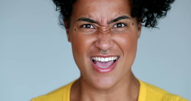 istock Millennial black woman shouting at camera 1395400312
