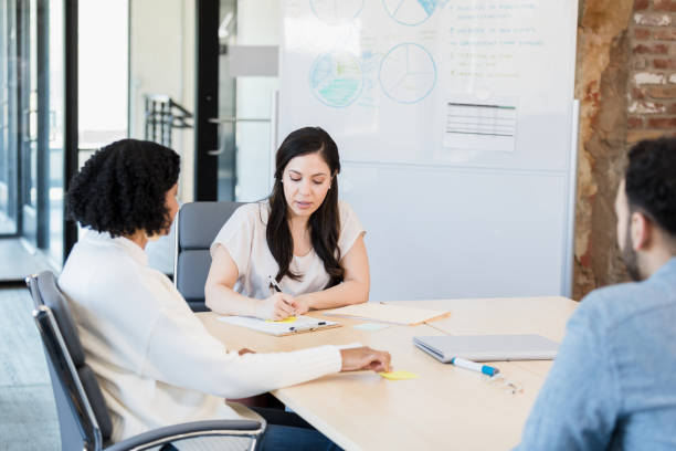 istock Colleagues meet to review project plan 1395400669