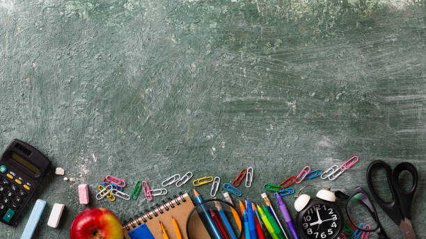 istock Banner Green chalkboard background with school supplies 1395401499