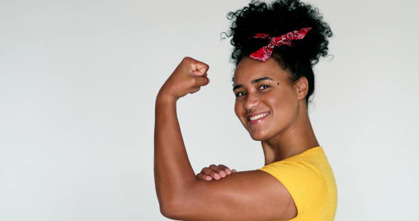 istock Black woman we can do it muscle pose 1395401624