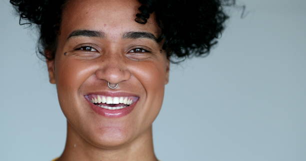 istock Happy young black woman laughing and smiling 1395401757