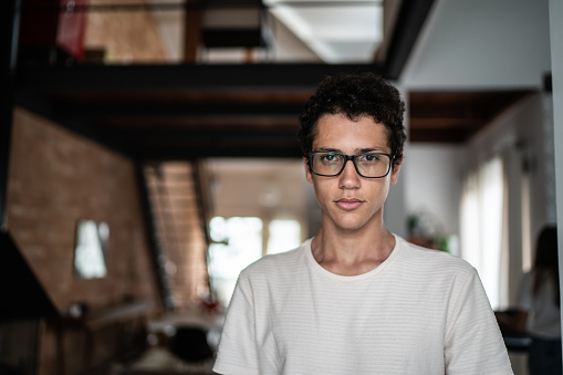 Portrait of a young man at home