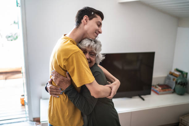istock Grandmother hugging grandson at home 1395402840
