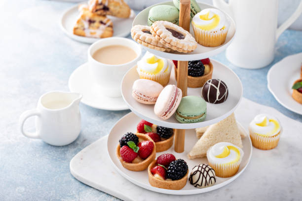 istock Spring or summer dessert table, three tiered tray with desserts 1395404236