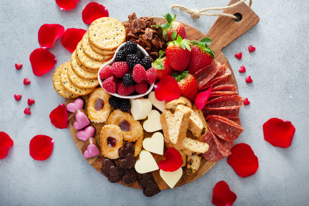 istock Cheese plate for Valentines day with snacks and fruit 1395404286
