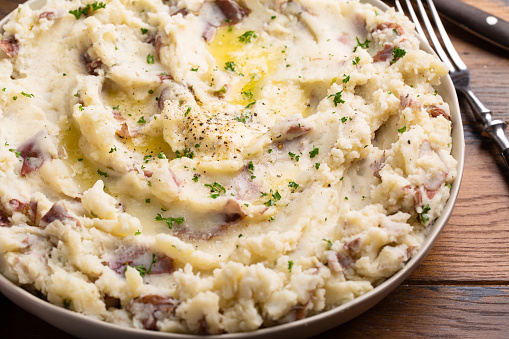 Traditional southern garlic mashed potatoes made with red potatoes skin on