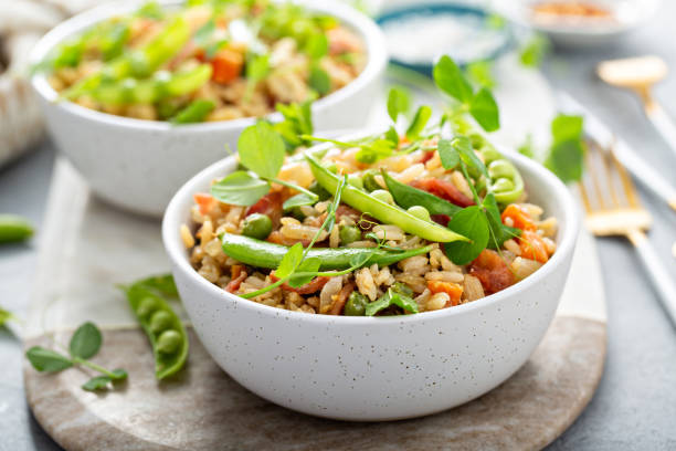 istock Breakfast fried rice with green peas and carrots 1395404301