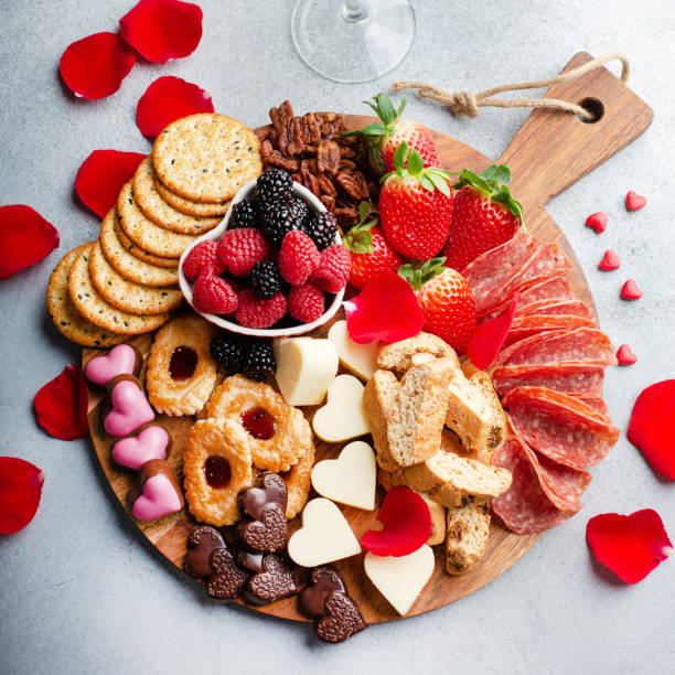 istock Cheese plate for Valentines day with snacks and fruit 1395404327