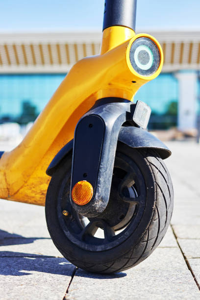 istock front view of rental electric scooters on the sidewalk 1395404606