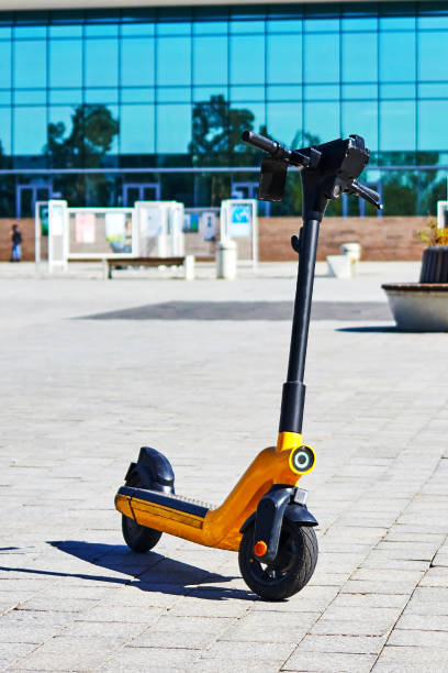 istock electric scooters for rent on the sidewalk 1395404616