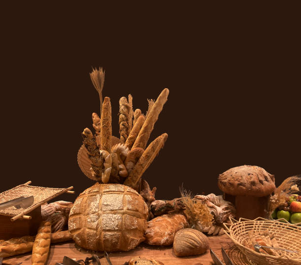 Artisan breads. Wooden table with various types of baguettes and homemade breads.