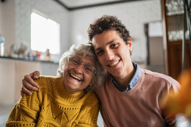 Portrait of happy senior woman and her grandson at home Portrait of happy senior woman and her grandson at home grandma portrait stock pictures, royalty-free photos & images