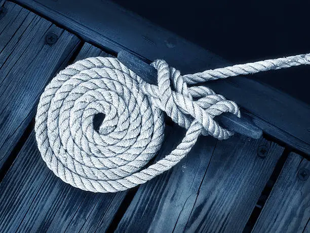 Photo of Close-up of rope tied as a nautical