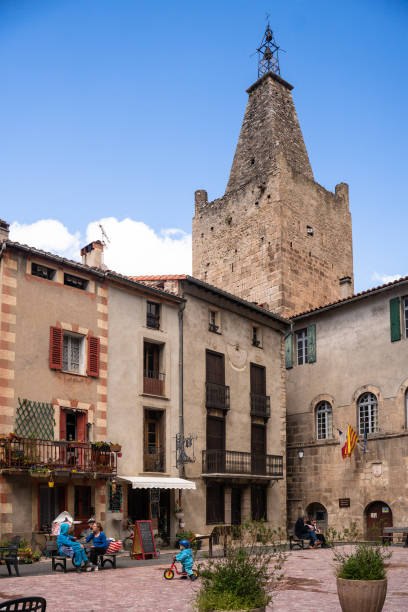 scenic Villefranche-de Conflent, France in the Catalonia Region. Villefranche-de Conflent, France - April 23, 2022:  Street scene in the historic, scenic Villefranche-de Conflent, France in the Catalonia Region. villefranche de conflent stock pictures, royalty-free photos & images