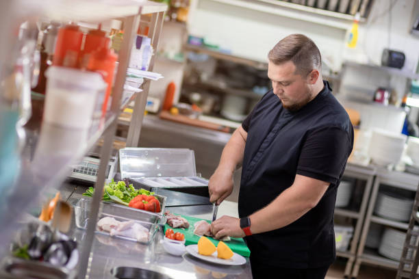 istock The chef cuts the chicken carcass and prepares it for marinating 1395410744