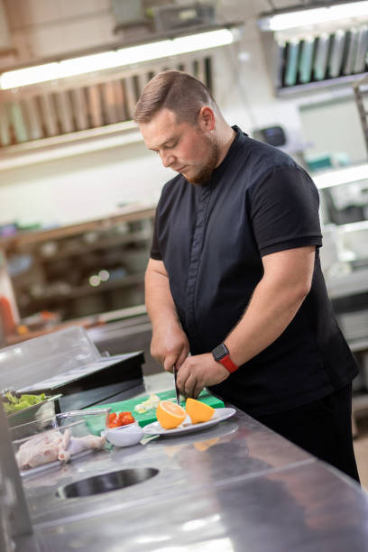 istock The chef in the kitchen cuts freshly onions for preparing chicken dish 1395410753