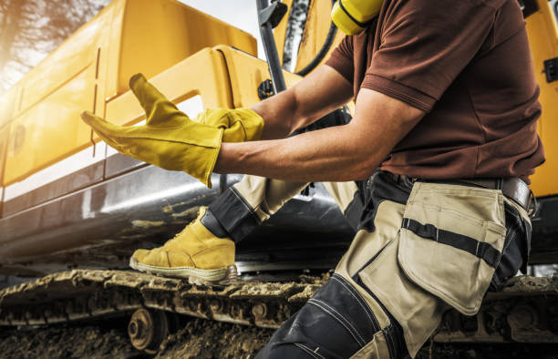 istock Heavy Construction Equipment Operator Wearing Safety Gloves 1395412822